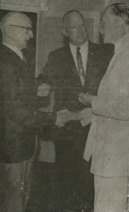 Mr Thomas (left) being presented to the Governor of Queensland, Sir Henry Abel Smith by Ald. G.C. Sykes president of the Gympie R.SL sub branch.
